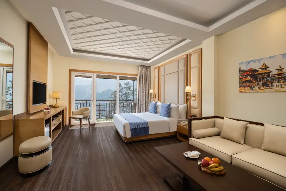 Guest room with sitting area and balcony